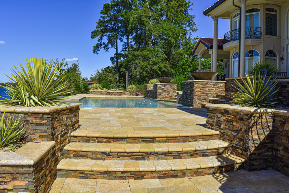 Pool patio hardscaped with stairs, fountains and incredible views.